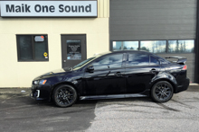 Black 2016 Mitsubishi Lancer with sleek dark window tint